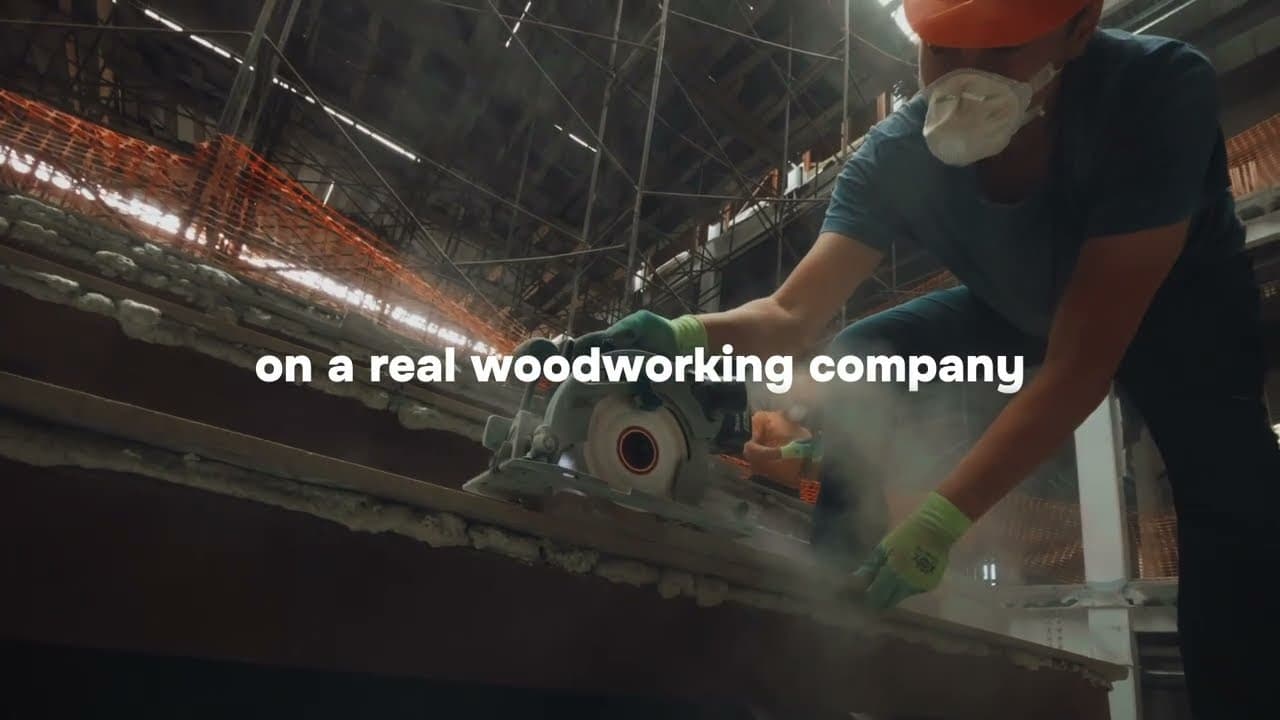 Craftsman cutting timber with a circular saw in the iker workshop